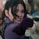 Hailee Steinfield as Kate Bishop pulls back hard on her bow to release a trick arrow in Hawkeye.